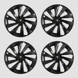 Vier schwarze MV Spiral-Radkappen mit Tesla-Logo für Model Y 2025.