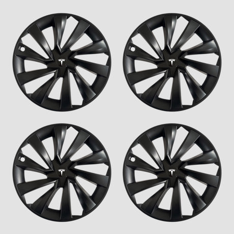 Vier schwarze MV Spiral-Radkappen mit Tesla-Logo für Model Y 2025.