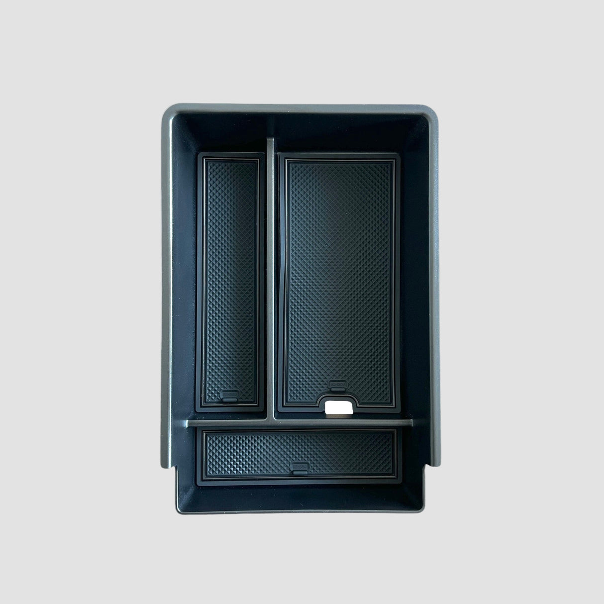 Aufbewahrungsbox für die Armlehne eines Xpeng G6, in der Farbe Schwarz.